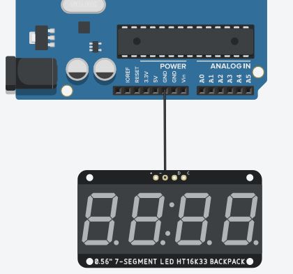 Passo 1 - Conectar um jumper wire no ground até a porta negativa do display 7 segmentos (timer)